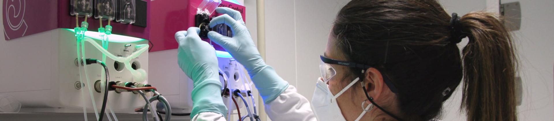 HIPRA technician working with bioreactors